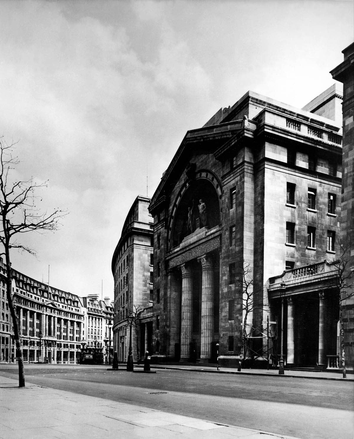 This picture shows the exterior of Bush House in London, with its Corinthian Columns, and statues of Ariel and Prospero.